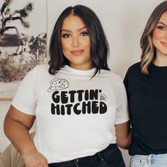 two women standing next to each other wearing t - shirts that say gettin'hitched