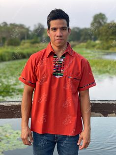 This beautiful Traditional Guayabera for Men has colorful embroidered details and adds a sophisticated flare to your wardrobe. This elegant button up Shirt is perfect for special occasions such as Mexican Fiestas, Quinceañeras, Weddings, etc. Traditional Summer Shirt With Camp Collar, Traditional Cotton Camp Shirt For Summer, Traditional Fit Short Sleeve Shirt, Traditional Cotton Camp Shirt With Short Sleeves, Traditional Red Short Sleeve Top, Traditional Red Top With Short Sleeves, Traditional Red Short Sleeve Shirt, Traditional Red Summer Shirt, Casual Red Shirt For Festivals