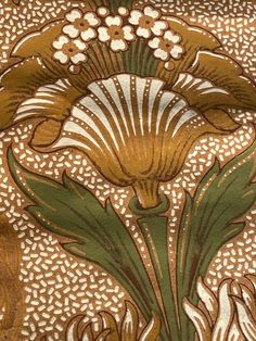 an intricately designed fabric with flowers and leaves