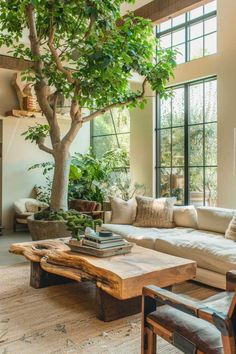 a living room filled with furniture and a tree in the middle of it's center