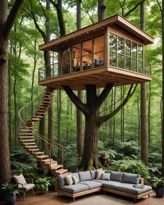 a tree house with stairs leading up to the upper floor and a couch in front of it