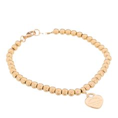 This is an authentic TIFFANY 18K Rose Gold 4mm Return To Tiffany Bead Heart Tag Bracelet. The bracelet is crafted of 18-karat rose gold and features polished 4mm beads and a heart charm accented with the signature 'Return to Tiffany' engravings. Elegant Heart-shaped Bracelets With 8mm Beads, Elegant Heart-shaped 8mm Beads Bracelet, Tiffany Heart Bracelet, Braclets Gold, Tiffany Gold, Tiffany Bracelet, Bead Heart, Return To Tiffany, Heart Tag