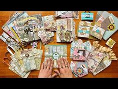 a table topped with lots of different types of cards and paper work on top of it