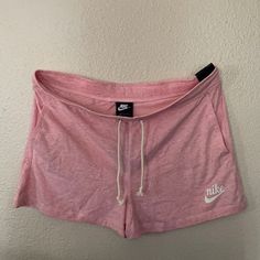 Pink Nike Shorts Perfect For Running Errands Lounging At Home Or The Beach Nike Bottoms With Elastic Waistband For Leisure, Nike Leisure Bottoms With Elastic Waistband, Nike Lounge Shorts With Pockets, Nike Loungewear Shorts With Pockets, Comfortable Nike Bottoms With Built-in Shorts, Nike Shorts With Pockets For Loungewear, Nike Casual Athletic Shorts For Summer, Casual Nike Athletic Shorts For Summer, Casual Nike Shorts For Summer