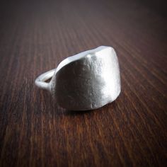 * simple chunky ring with a soft brushed finish * modelled in wax and cast in sterling silver * 15mm high * band: 2mm * size: 8.5 * All jewelry is designed and made, one piece at a time, by me, in my studio in Montreal. * Made in Canada * Most of my pieces are one-of-a-kind. Once the wax model is cast, the mold is gone. However,  I do reproduce items from the same design. By working this way, each piece retains its unique and individual personality. Rustic Ring, Rustic Rings, Chunky Ring, Organic Rings, Meme Design, Made Jewelry, Chunky Rings, Statement Ring Silver, Statement Ring