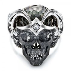 #101968 Galatea Jewelry by Artist is available at Joseph Jewelry.This striking ring features a skull carved in sterling silver with a prong set diamond in the forehead and a... Formal Gothic Skull Ring, Gothic Skull Ring For Formal Occasions, Symbolic White Gold Skull Ring For Anniversary, Luxury White Gold Skull Ring Gift, Luxury Silver Skull Ring For Formal Occasions, Luxury Carved White Gold Rings, Luxury Skull Ring For Gift, Luxury Sterling Silver Skull Ring, Luxury Skull Ring As Gift