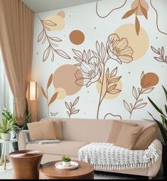 a living room with a couch, coffee table and wall mural