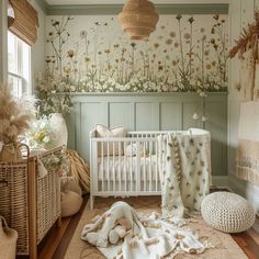 a baby's room with flowers on the wall, and a white crib