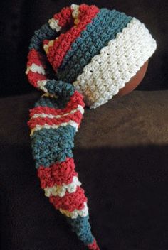 a crocheted hat with a red, white, and blue stripe on it