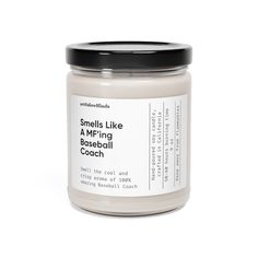 a jar of smells like a m - ring baseball coach candle on a white background