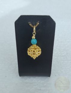 ★ Filigree ball pendant, handmade from solid sterling silver, which is plated with 24k gold. Replicas of traditional Dubrovnik "botuni" jewelry from the 19th century - Croatian ethnic, heritage jewelry. Versatile to wear with any outfit, and perfect for any occasion. Adorned with natural turquoise gemstone. ★ Drop length: 2.4 cm ( 0.94" ) Filigree ball diameter: 1.1 cm ( 0.43" ) Matching earrings: https://www.etsy.com/listing/1676571966/traditional-croatian-filigree-earrings -------------------- Heritage Jewellery, Filigree Earrings, Ball Pendant, Dubrovnik, Natural Turquoise, Turquoise Pendant, Turquoise Gemstone, Natural Leather, Necklace Designs