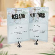 two cards with the names of new york and iceland on them sitting on a table