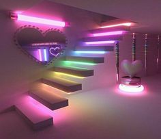 there is a heart shaped mirror on the wall next to some stairs that are lit up with neon lights