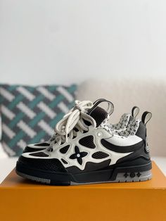 Embrace a bold and sophisticated aesthetic with these Louis Vuitton LV Skate-inspired sneakers in a timeless black and white colorway. Crafted with meticulous attention to detail, these shoes feature a unique blend of materials, including breathable mesh and luxurious leather, for a sporty and refined look. The signature Louis Vuitton monogram subtly adorns the design, adding a touch of understated luxury. Whether you're hitting the streets or the skate park, these sneakers will elevate your sty Fall Winter Jacket, Loafer Sneakers, Bottega Veneta Shoulder Bag, Skate Park, Shoe Box, The Streets, White Sneaker, Loafer Shoes, Sneaker Boots