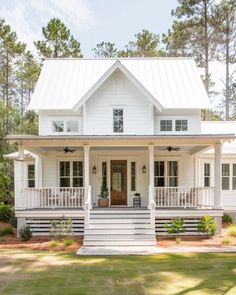 a white house with porches and stairs