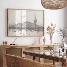 a dining room with wicker furniture and a painting on the wall above it's table