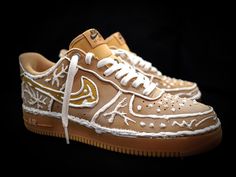 Treat yourself this holiday season with a pair of Gingerbread AF1s! This unconventional Nike design is hand-crafted by Shoebaker and is sure to add a sweet twist to your holiday wardrobe. Tap into your festive spirit and get yourself a pair today!  Read before purchasing  This is a service to customize a shoe with engraving, which costs a specified amount that includes materials and artist time. Price listed includes the cost of the Air Force One needed to [produce the art piece.  The AF1 is purchased from Nike.com or Third-Party with collaboration of Nike. The available sizes are 3.5-15 US, and the turn-around time is 2-3 weeks from purchase. Nike Design, Air Shoes, Air Force 1 Custom, Nike Air Shoes, Air Force One, Christmas Custom, Force One, Sneakers Athletic, Air Force Ones