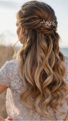 the back of a woman's head with long blonde hair and a tiara