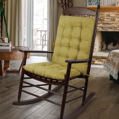 a rocking chair in front of a fire place