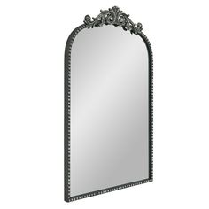 an ornate mirror on a white background