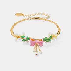 Capturing the delicate beauty of nature, this Lily Of The Valley Bowknot Bracelet is lovingly crafted with fine enamel details. Its elegant bowknot design ensures that you make a stunningly stylish statement with every wear. Perfect for adding a subtle, sophisticated touch to any ensemble. DETAILS Plating: 18k Gold on Brass, Enamel Materials:  18k Gold on Brass Measurements: Length: 6.10"(15.5cm) + Extender: 2.36"(6.0cm) Weight:  9.5g Feminine Flower Bracelet Perfect As A Gift, Feminine Flower Bracelet Perfect For Gifts, Flower Decoration Bracelets As Gift, Feminine Flower Bracelet For Gift, Delicate Jewellery, Star And Moon Necklace, Diamond Evil Eye, Delicate Beauty, Enamel Necklaces