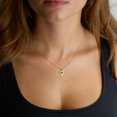 Evoking both modern and ancient energies, a luscious rose cut emerald is wrapped in warm 22k gold, set on a hammered 22k gold disk, and suspended from a delicate 14k gold chain. Simple and so elegant. Pendant measures approximately 3/8 inch in diameter. Matte finish. Gold Emerald Birthstone Necklace In Minimalist Style, Dainty Gold Emerald Round Necklace, Gold Dainty Emerald Necklace, Minimalist Gold Emerald Birthstone Necklace, Gold Emerald Necklace With Round Birthstone, Gold Jewelry With Coin Pendant For May Birthstone, Gold Minimalist Emerald Birthstone Necklace, Dainty Gold Emerald Necklace, Round Gold Plated Emerald Gemstone Necklace