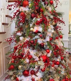 a christmas tree decorated with red and white ornaments