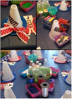 the table is set up for a party with plastic cups, candy and other items