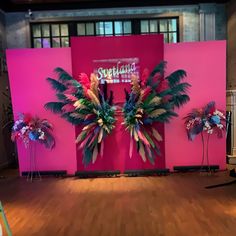 the stage is decorated with flowers and palm trees