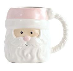 a ceramic mug with a santa claus face on the front, and a pink nose