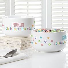 two bowls filled with cereal sitting on top of a white counter next to each other