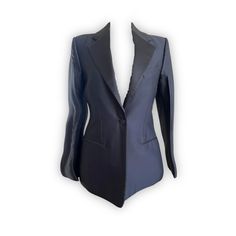 Revamp your wardrobe with this timeless black CELINE BY PHOEBE PHILO TUXEDO blazer, featuring striking satin lapels and pockets. Make a bold fashion statement in this designer item, crafted from luxury materials. Dare to be different in this exquisite FR 36 blazer. Wow your friends and colleagues with this sleek and stylish look - perfect for any occasion! If you have an inquiry or specific questions for this archive piece: Please send us a chat on our website or send an email to info@theremoda. Designer Black Blazer With Pressed Crease, Party Blazer With Structured Boning In Black, Designer Black Blazer With Notch Lapel, Designer Black Blazer With Hidden Buttons, Designer Silk Blazer With Hidden Button Closure, Designer Black Blazer With Suit Collar, Long Sleeve Silk Suit For Office, Designer Silk Blazer For Office, Black Evening Suits With Structured Boning