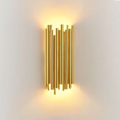 a wall light that is on the side of a wall with some lights in it