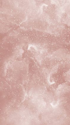 an abstract pink and white background with small speckles in the center, as well as stars