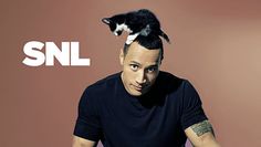 a man with a cat on top of his head