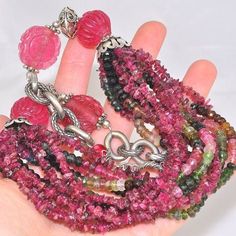 Material: Genuine Sterling Silver (925 silver, 92.5% silver content) Necklace Stone(s): 4 genuine carved pink tourmaline, 6 genuine multicolor tourmaline beaded strands and 6 genuine pink tourmaline chip strands Necklace Length: 18.5 inches Deep: 2 inches Weight: 141.5 grams Clasp: Toggle Stamp/Mark: AKR, STERLING Serial Number: n20587 Tourmaline is a coveted stone that comes in a wide range of colors from black to pink, green and blue. Crystals which display more than one color together are com Necklace Stone, Tourmaline Beads, Tourmaline Crystal, Watermelon Tourmaline, Bead Strand, Strand Necklace, Blue Crystals, Pink Tourmaline, Necklace Length