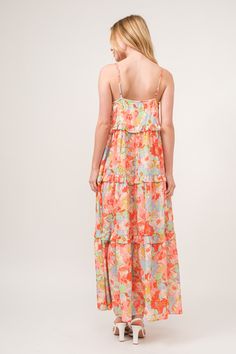 The floral ruffled tiered maxi cami dress is a stunning and feminine choice for any special occasion. With its floral print and tiered design, this dress exudes elegance and romance. The ruffled tiers add movement and depth to the dress, creating a whimsical and ethereal look. Perfect for weddings, parties, or summer outings, this dress is both beautiful and versatile. Embrace your romantic side and shine in the floral ruffled tiered maxi cami dress for a captivating and elegant ensemble. Elevat Summer Tiered Maxi Dress With Floral Print, Floral Print Tiered Maxi Dress For Vacation, Tiered Floral Print Maxi Dress Vacation, Tiered Floral Print Maxi Dress For Garden Party, Tiered Floral Print Maxi Dress For Summer, Flowy Floral Print Tiered Dress For Garden Party, Feminine Flowy Floral Print Tiered Dress, Flowy Feminine Tiered Dress With Floral Print, Tiered Floral Maxi Dress For Garden Party