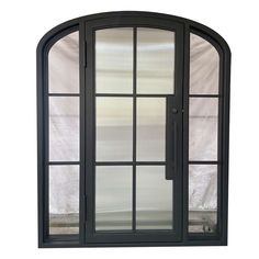 an arched glass door with black frame and side panels on the outside, in front of a white background