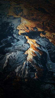 an aerial view of the mountains from space