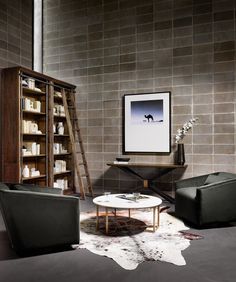 a living room filled with furniture and a book shelf