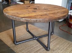 a wooden table sitting on top of a rug