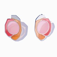 two pink and orange earrings on white background