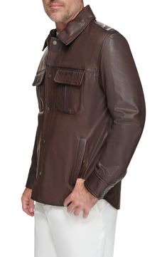 Workwear-inspired design defines a ruggedly handsome jacket built from fine lamb leather. 30" length Spread collar Leather Professional leather clean Imported Rugged Leather Jacket With Button Closure For Work, Masculine Long Sleeve Leather Jacket For Work, Fall Leather Jacket For Outdoor, Leather Jacket For Outdoor Fall Season, Long Sleeve Leather Jacket For Work, Fall Outdoor Leather Jacket, Rugged Brown Leather Jacket With Flap Pockets, Classic Leather Outerwear With Leather Lining, Rugged Leather Jacket For Workwear