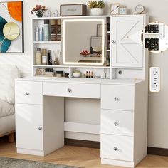 a white desk with a mirror and lights on it