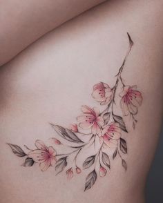 a woman's stomach with flowers on it