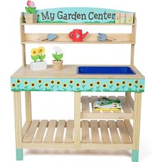 a wooden garden center with gardening tools and flowers on the counter top, in front of a white background