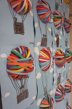 colorful hot air balloons are hanging on the wall