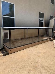 a dog kennel in front of a building