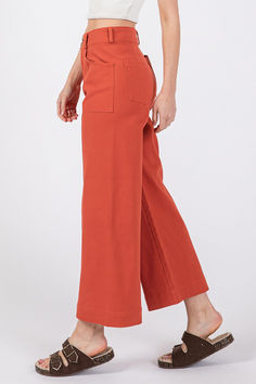 These wide-leg pants with front pockets are designed for both style and comfort. The super-soft feel fabrication ensures a luxurious touch against the skin. With 4 pockets, including front pockets for added convenience, these pants offer both functionality and style. The adjustable button closure allows for a customizable fit, while the wide-leg silhouette adds a modern and flattering look to your outfit. Perfect for a casual yet polished ensemble, these pants are versatile and on-trend for any Orange Wide-leg Pants With Relaxed Fit, Wide Leg Cropped Pants, Skirt Leggings, Basic Style, Cropped Pants, Bottoms Pants, Leg Pants, Soft Fabric, Fig