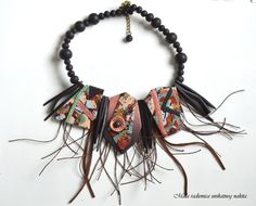 the necklace is decorated with beads and tassels